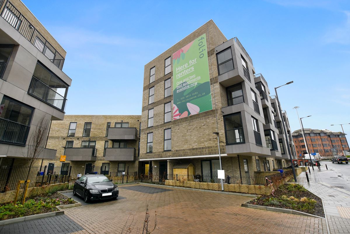 Greenstock Lane development building with large folio advertising board on the side of it.