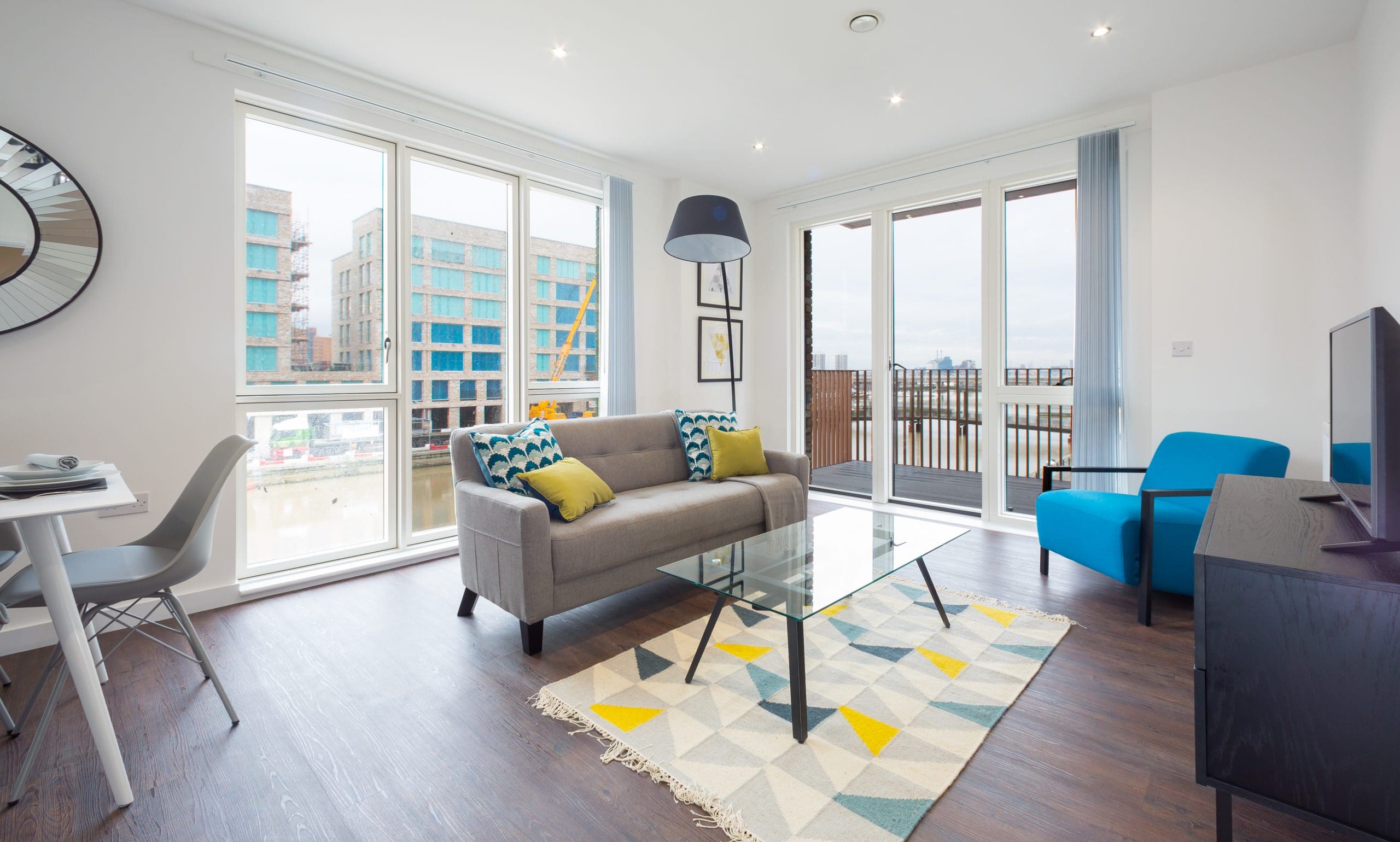 Living room and balcony at Royal Albert wharf development.