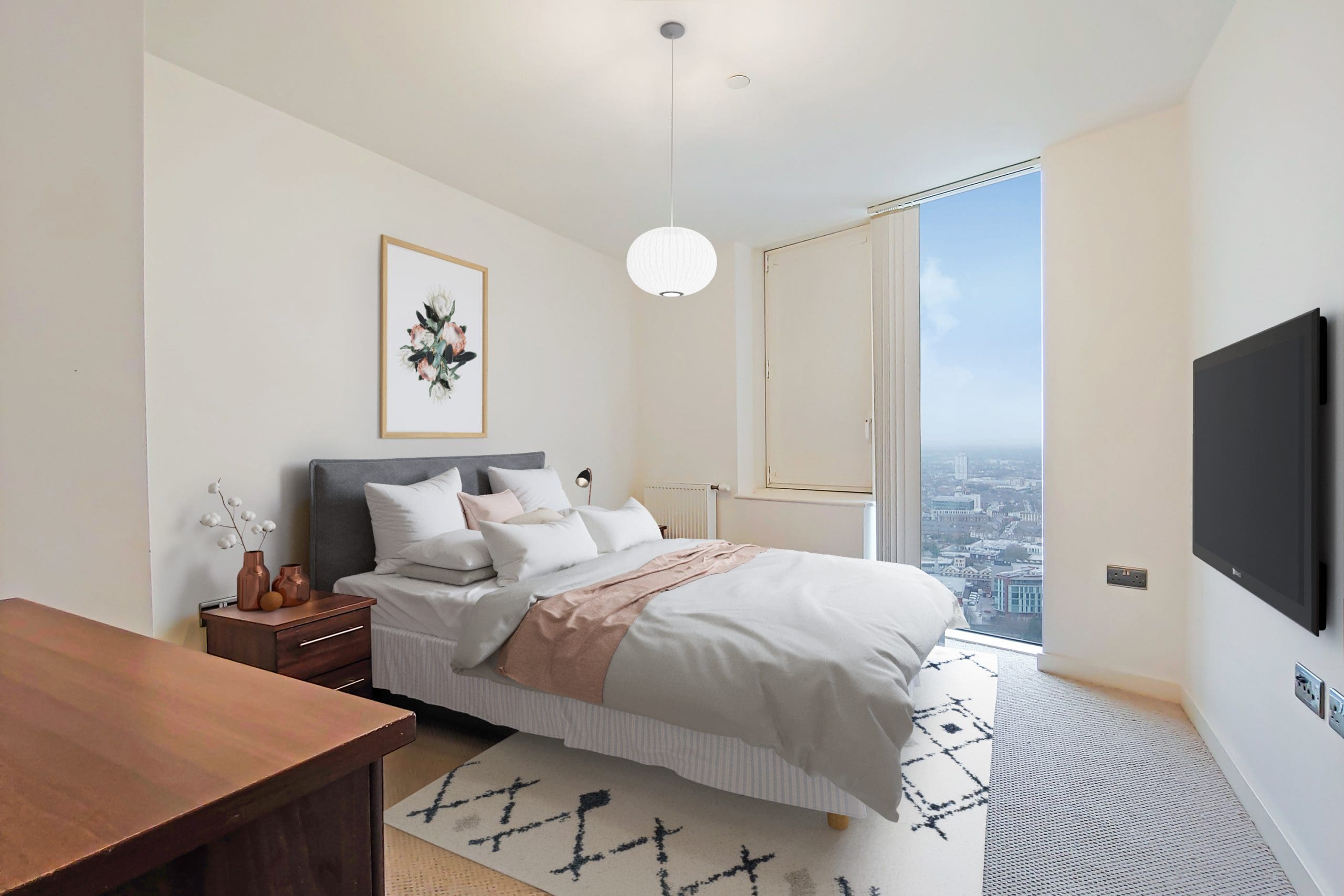 Bedroom with a double bed and floor to ceiling window at the Stratford Halo development.